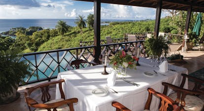 The Villas at Stonehaven Tobago villa veranda dining views of infinity pool and ocean