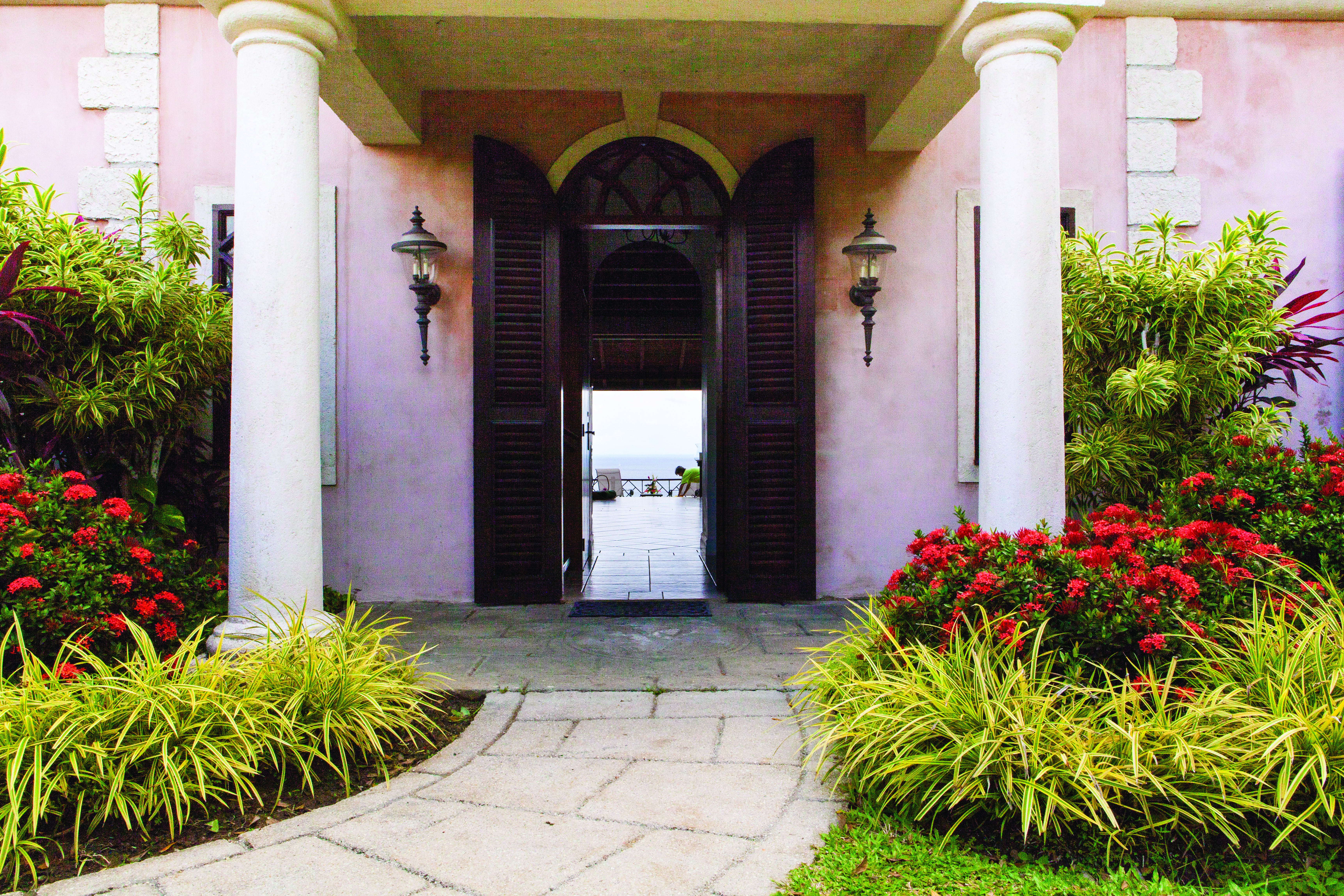 The Villas at Stonehaven Tobago villa entrance pink building shrubbery