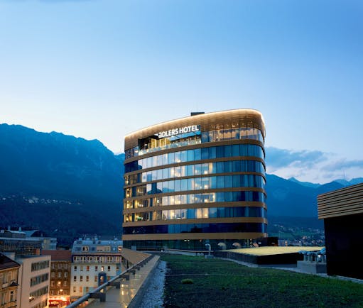 Adlers Hotel Austria exterior view of building with mountains in the background