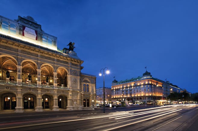 Hotel Bristol Vienna state opera house the hotel and a city street at night time