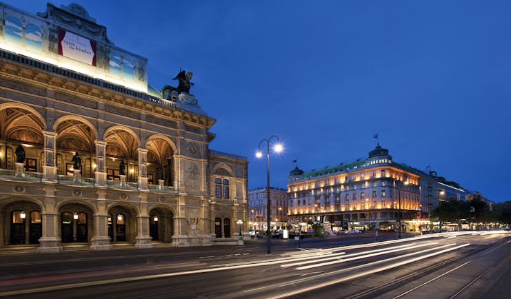 Hotel Bristol Vienna state opera house the hotel and a city street at night time