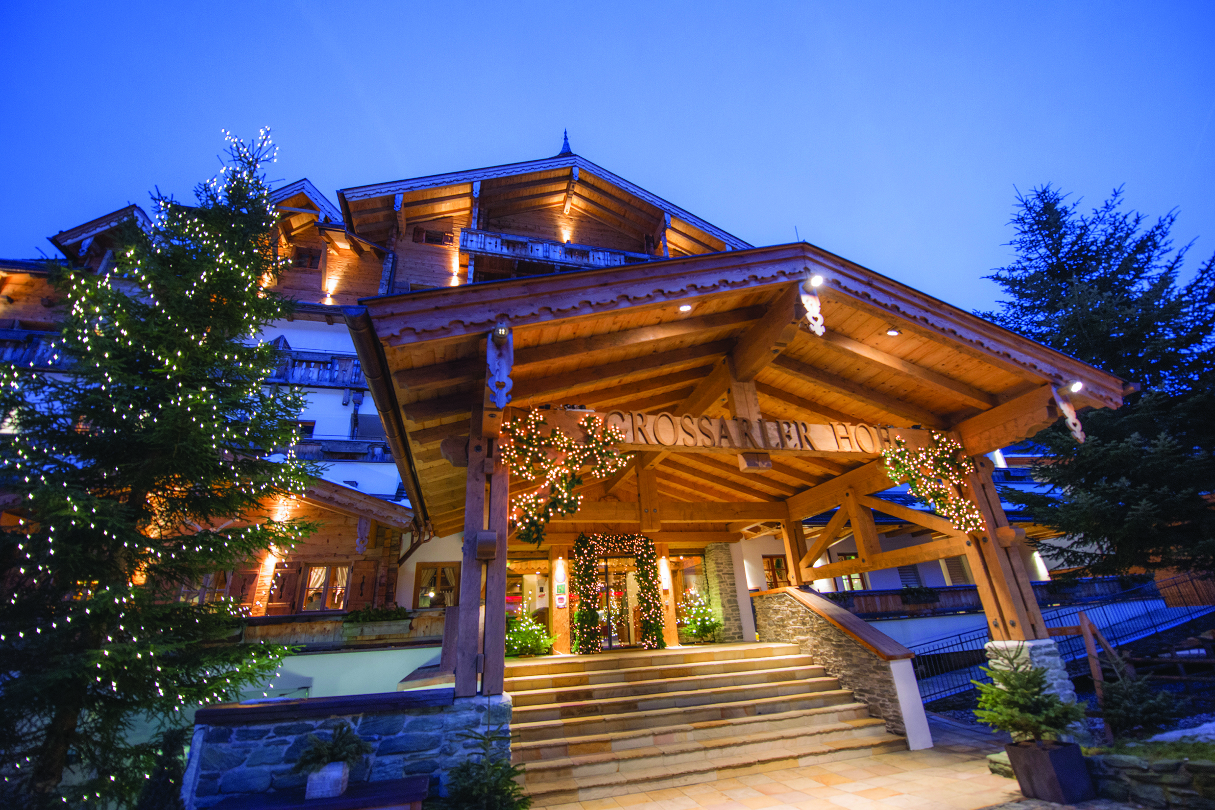 Grossarler Hof Austria exterior wooden building stone steps pine tree with lights