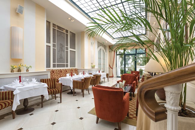 Hotel Kaiserhof Vienna winter garden conservatory room plants and comfortable seating
