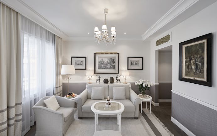 Hotel Sacher suite living room, sofas, table, chairs, elegant decor