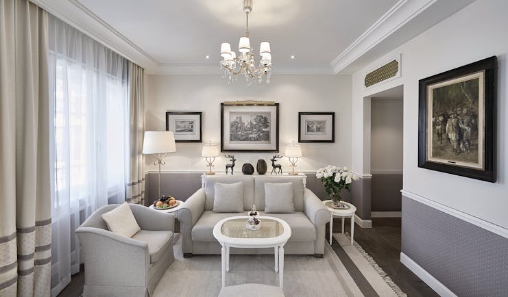 Hotel Sacher suite living room, sofas, table, chairs, elegant decor