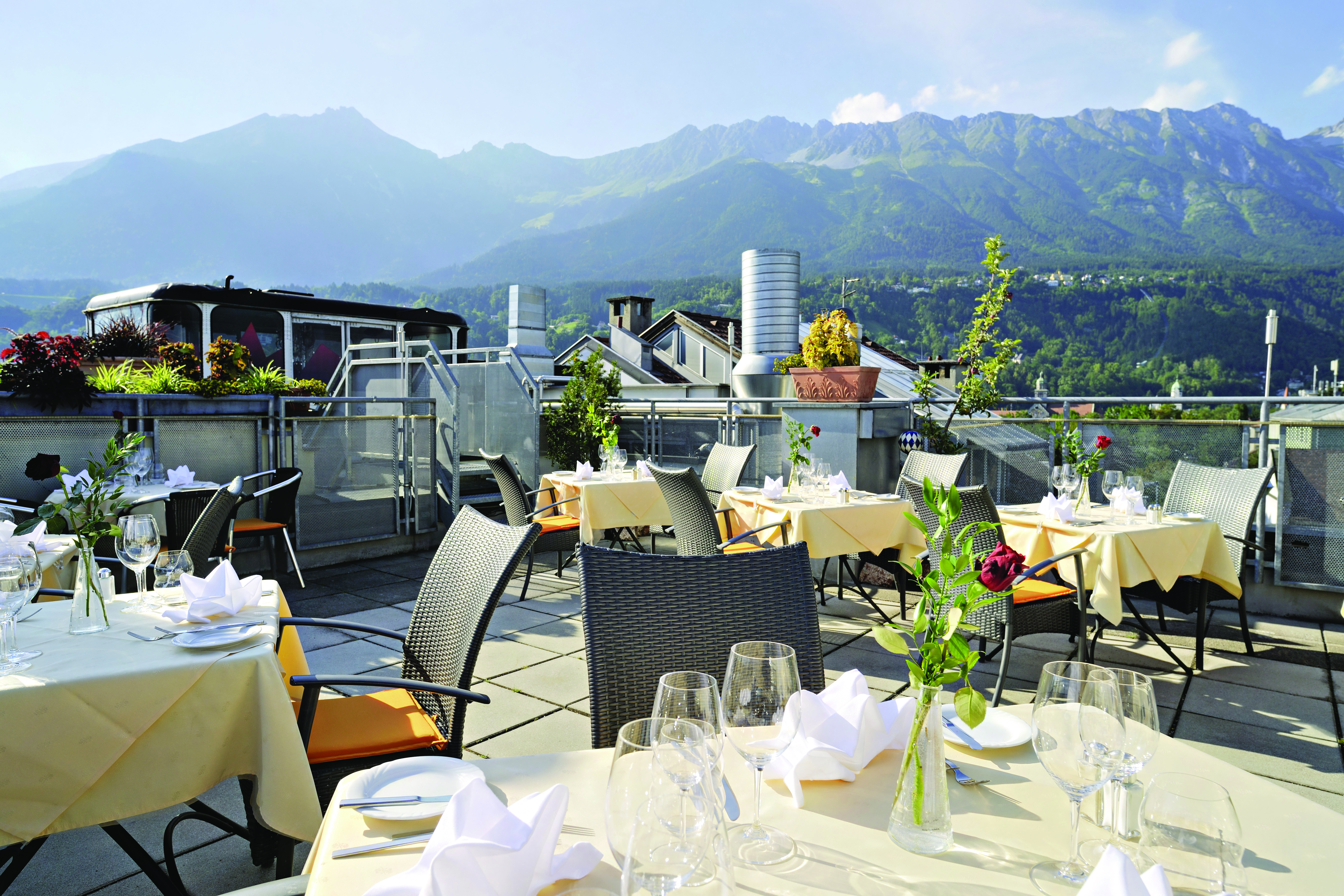 Hotel Schwarzer Adler dining terrace, outdoor dining area with mountain views