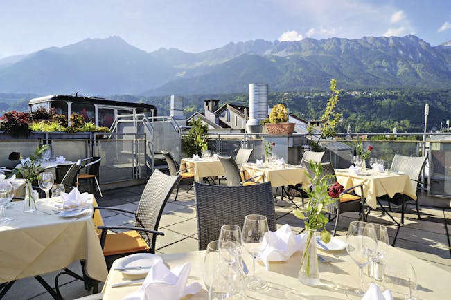 Hotel Schwarzer Adler dining terrace, outdoor dining area with mountain views