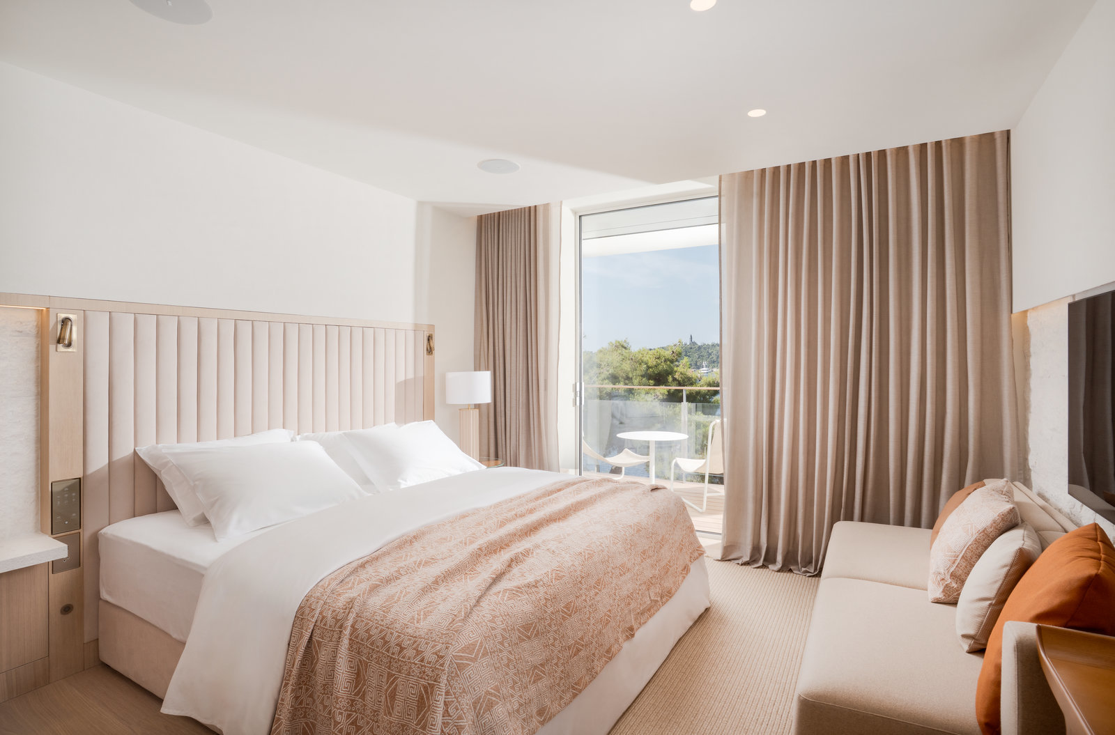 Villa Dubrovnik Superior Sea View room, with neutral colour palette and balcony with sea views