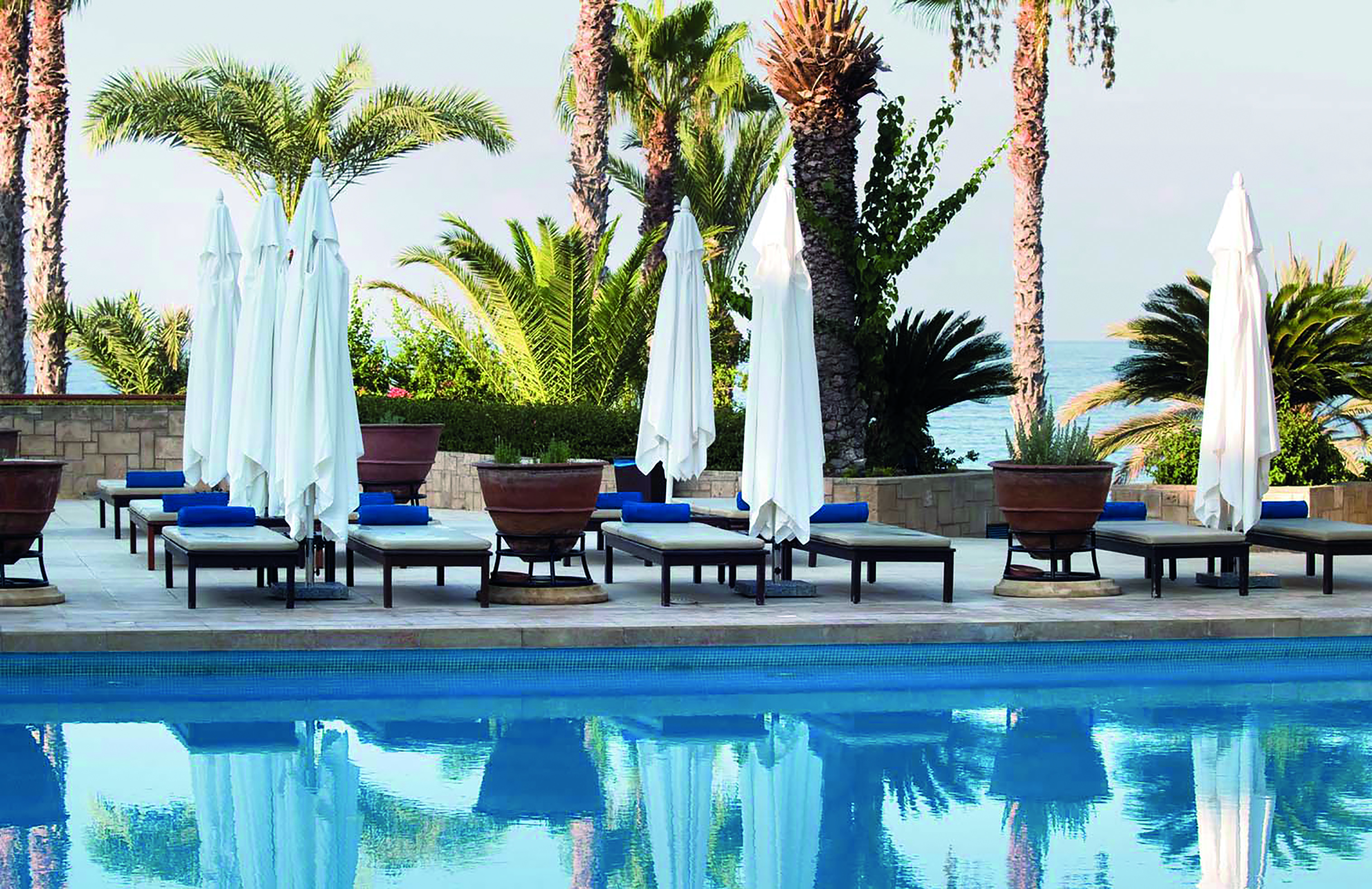 Annabelle Hotel Cyprus outdoor swimming pool with loungers and umbrellas