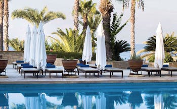 Annabelle Hotel Cyprus outdoor swimming pool with loungers and umbrellas