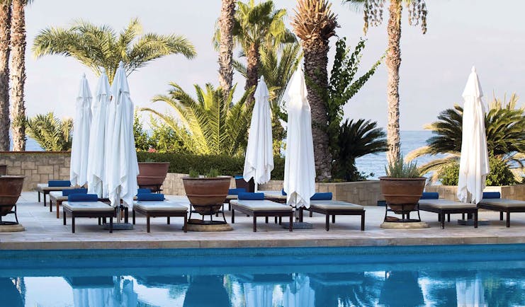 Annabelle Hotel Cyprus outdoor swimming pool with loungers and umbrellas
