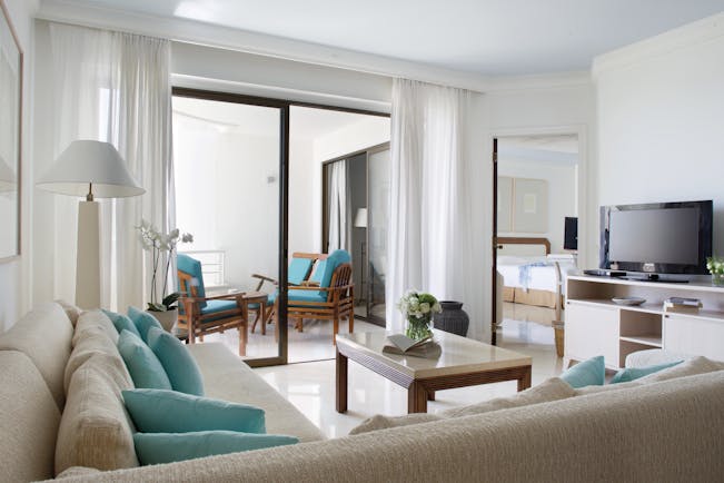 Annabelle Hotel Cyprus superior suite sitting room sofas and balcony with armchairs 