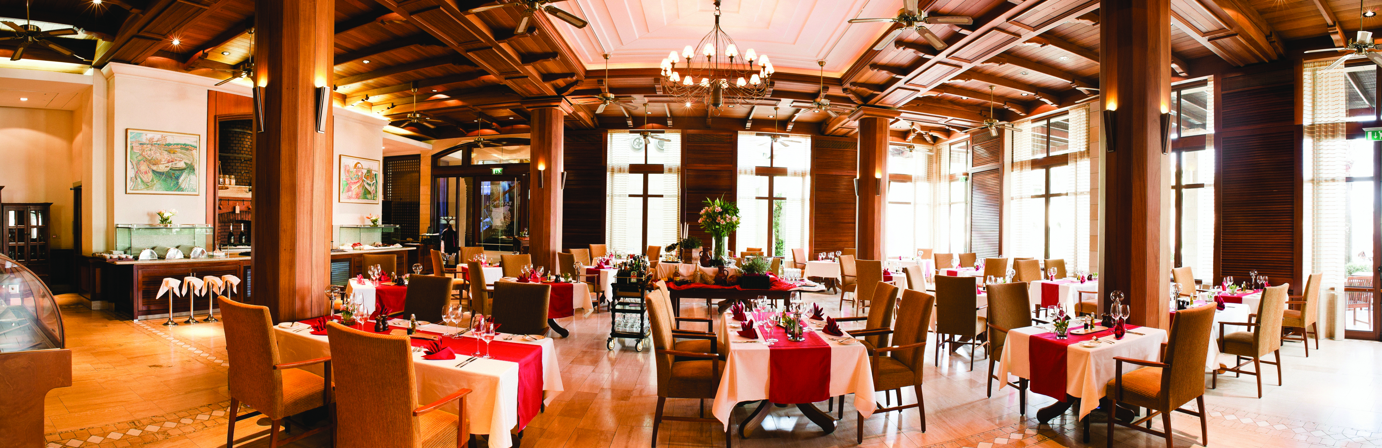 Columbia Beach Resort Cyprus restaurant Bacchus dining area with chandelier and wood panelling