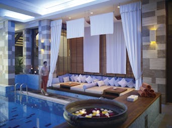 Columbia Beach Resort Cyprus indoor spa pool with sofa seating area and bowl of flowers