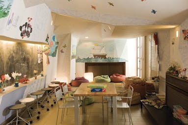 Columbia Beach Resort Cyprus kids club room with mural of a ship a table and chairs and beanbags