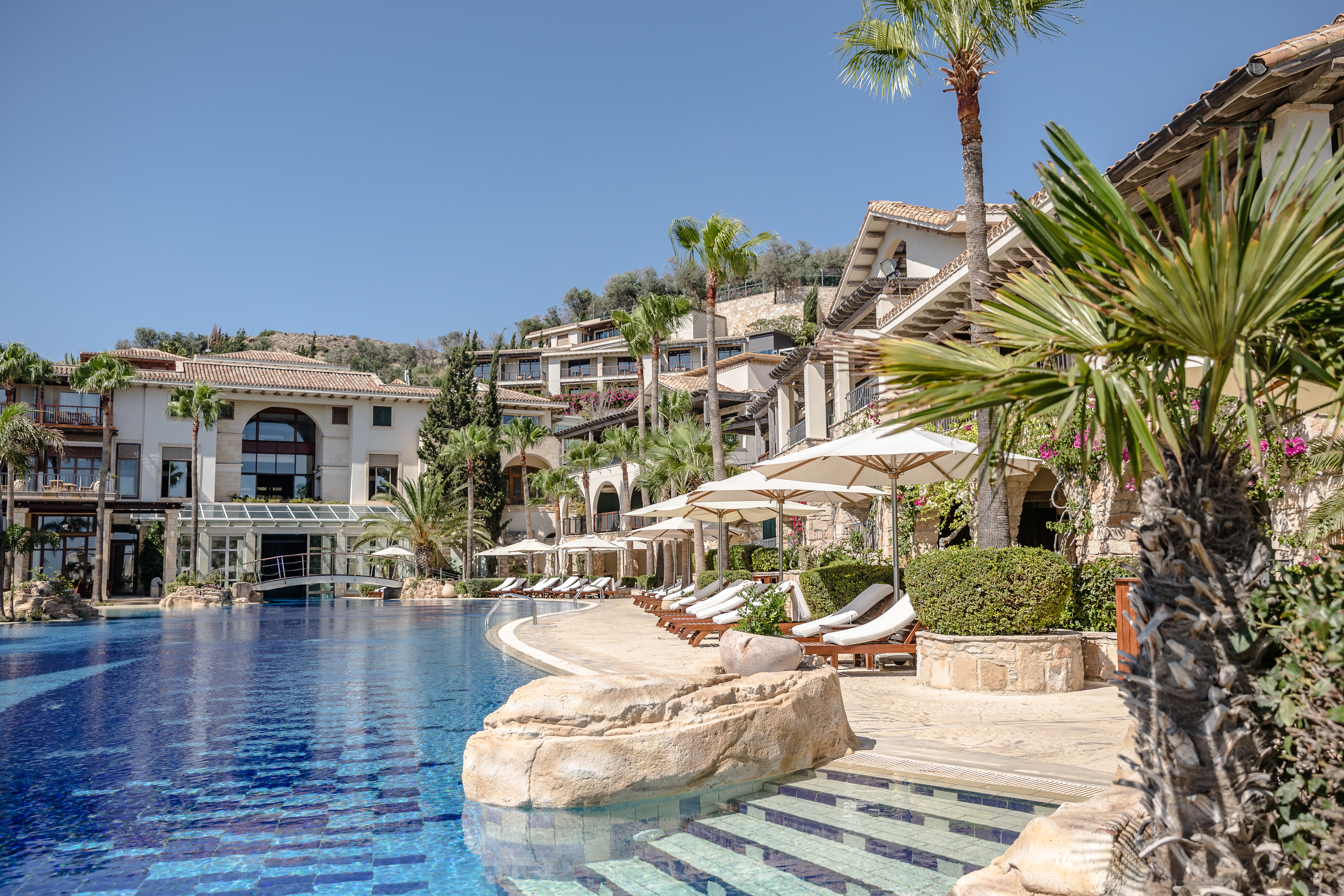 Columbia Beach Resort Cyprus outdoor pool with bridge and sun loungers