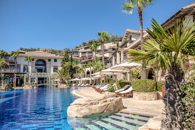 Columbia Beach Resort Cyprus outdoor pool with bridge and sun loungers