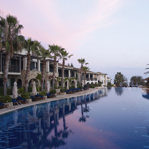 Columbia Beach Resort Cyprus outdoor pool at twilight with loungers and umbrellas