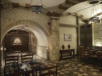 Columbia Beach Resort Cyprus restaurant Taverna dining area with stone tiled floors walls and archways 