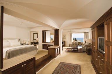 Columbia Beach Resort Cyprus suite with bedroom and sitting area and balcony with sea view