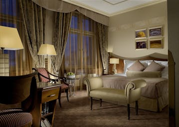 Art Deco Imperial executive room, double bed, chair, draped windows, sumptuous modern decor