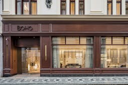 Hotel BoHo Prague exterior building with wooden facade large windows and a sign reading 'BoHo'