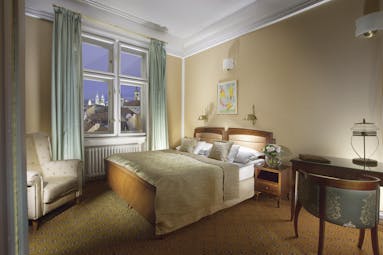 Hotel Paris Prague executive bedroom  armchair desk window with view of old town