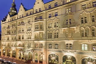 Hotel Paris Prague exteropr building with large windows sign reading 'Hotel Paris'