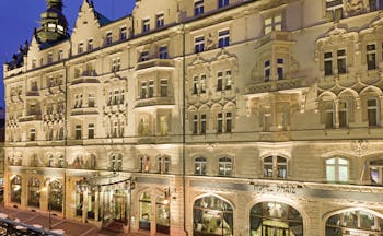 Hotel Paris Prague exteropr building with large windows sign reading 'Hotel Paris'
