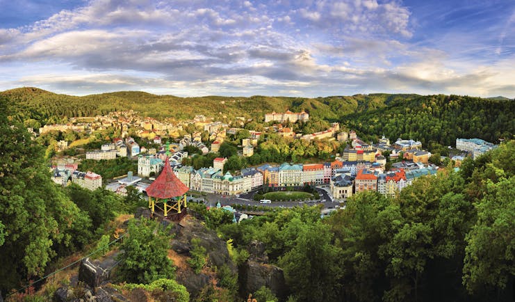 Hotel Quisisana Palace Karlovy Vary aerial view of a small town surrounded by wooded hills