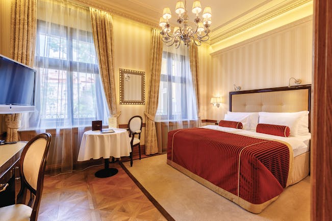 Hotel Quisisana Palace Karlovy Vary deluxe bedroom chandelier table and chairs and desk