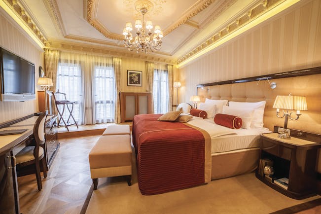 Hotel Quisisana Palace Karlovy Vary deluxe suite bedroom chandelier desk and television