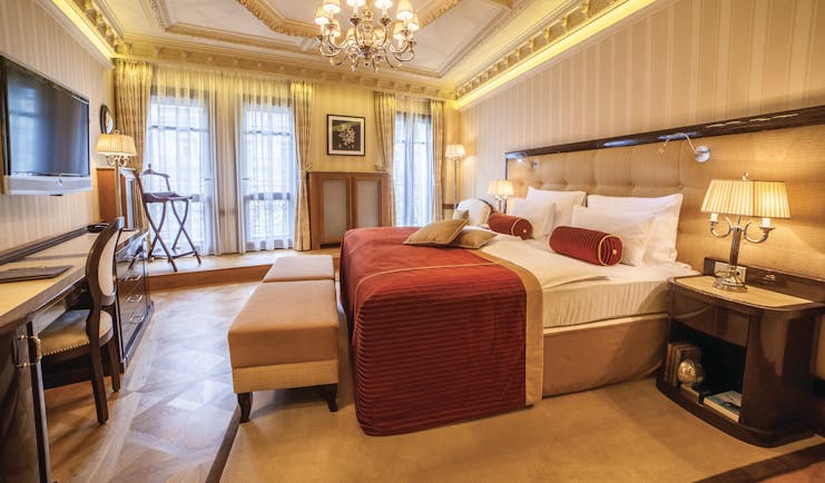 Hotel Quisisana Palace Karlovy Vary deluxe suite bedroom chandelier desk and television