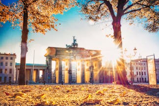 Autumn sunlight shining through the Brandenburg arched gate in Berlin