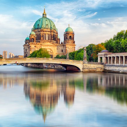 Berlin cathedral reflected in water of river spree