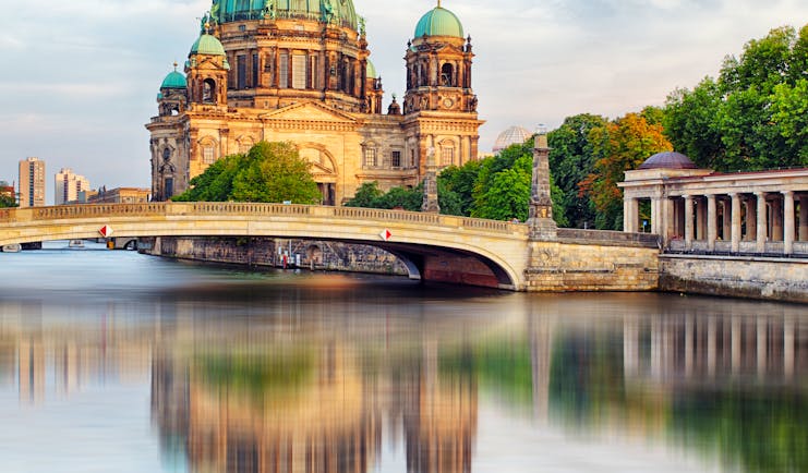 Berlin cathedral reflected in water of river spree
