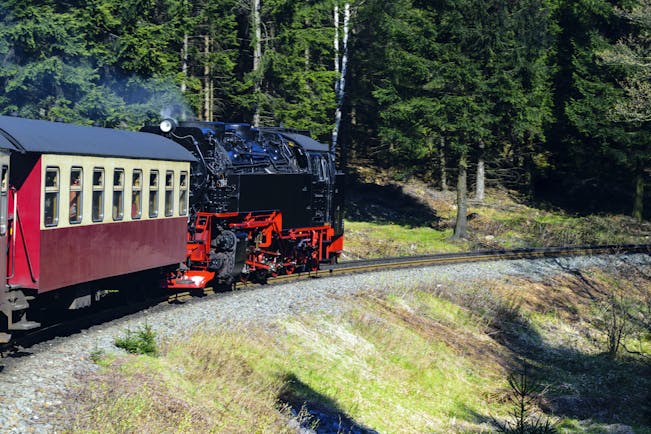 Black and red steam train in Harz mountains