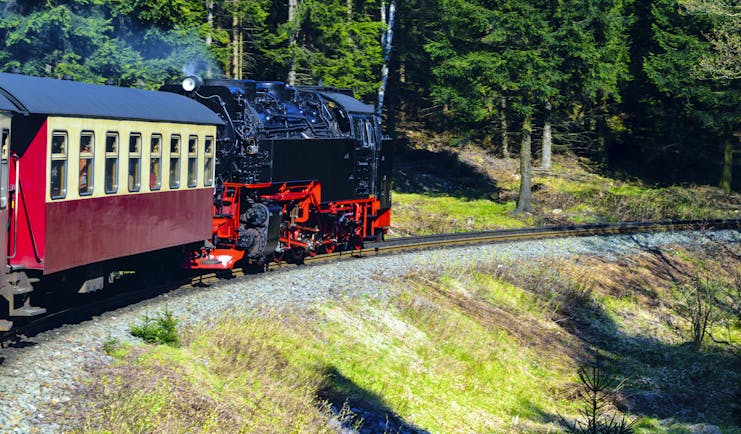 Black and red steam train in Harz mountains