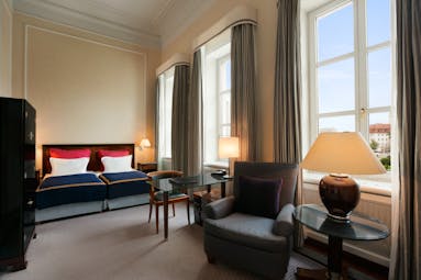 Taschenbergpalais superior room, double bed, armchairs, large windows, bright elegant decor