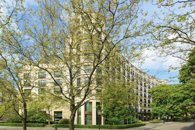 The Charles Hotel Munich exterior large building behind trees