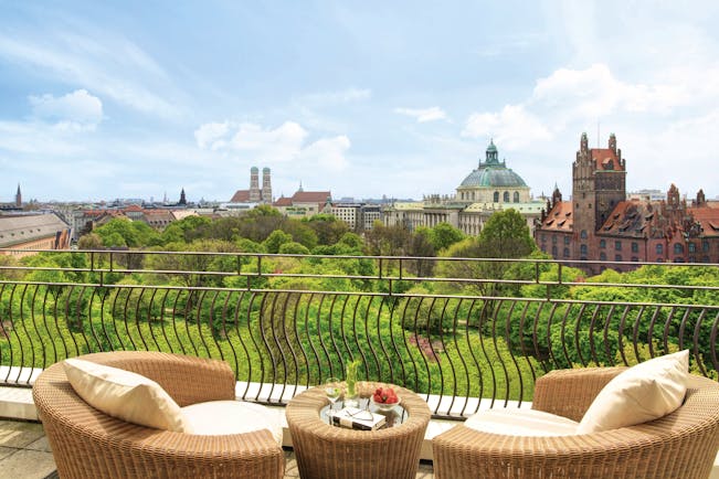 View from the balcony of the Monforte suite looking over Munich and lots of greenery 