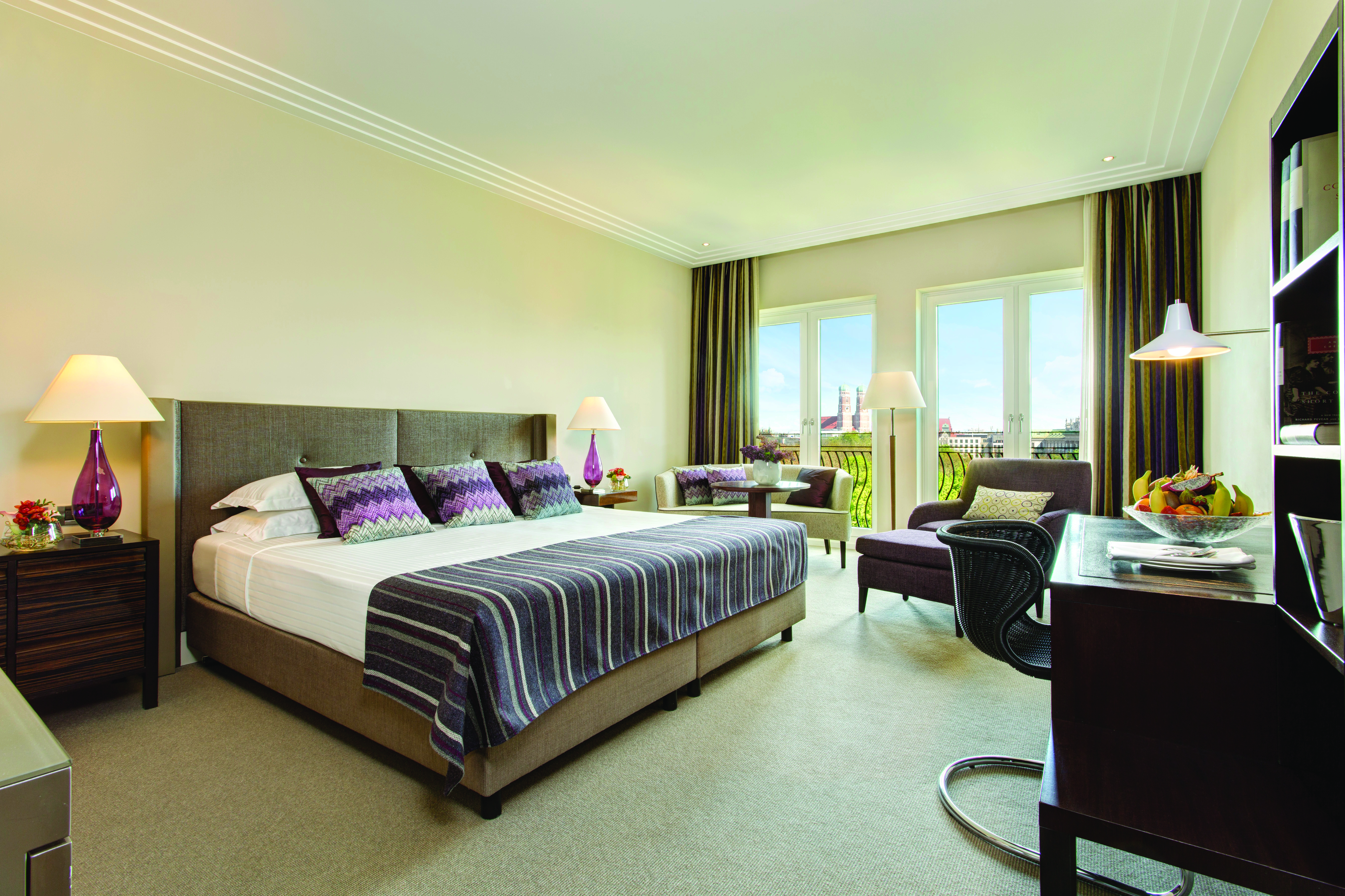Superior deluxe room at the charles hotel with large bed, doors opening onto a balcony and a flat screen television