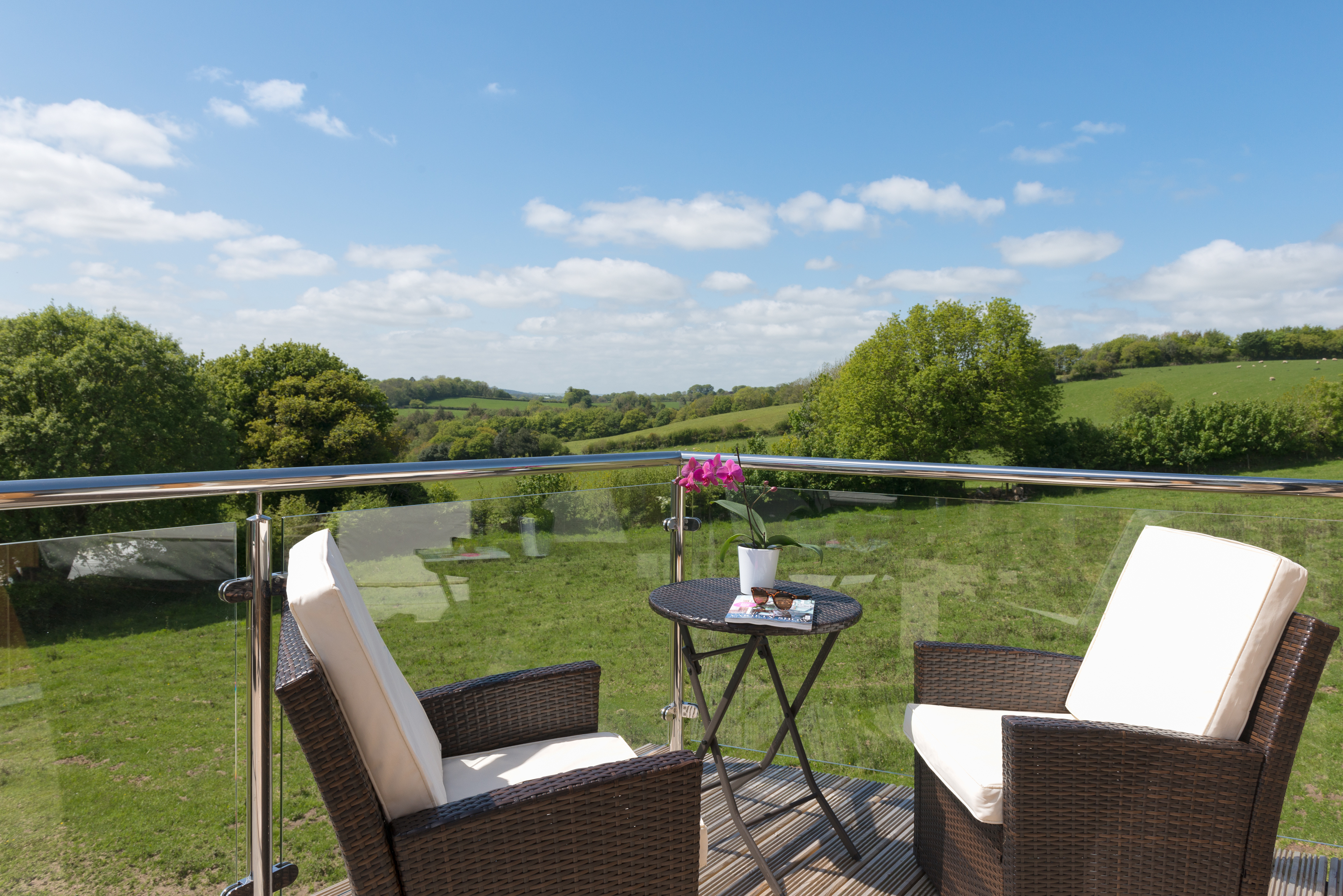 Horn of Plenty Devon view of gardens and hills from a balcony