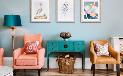 Horn of Plenty Devon orange chairs and blue cupboard