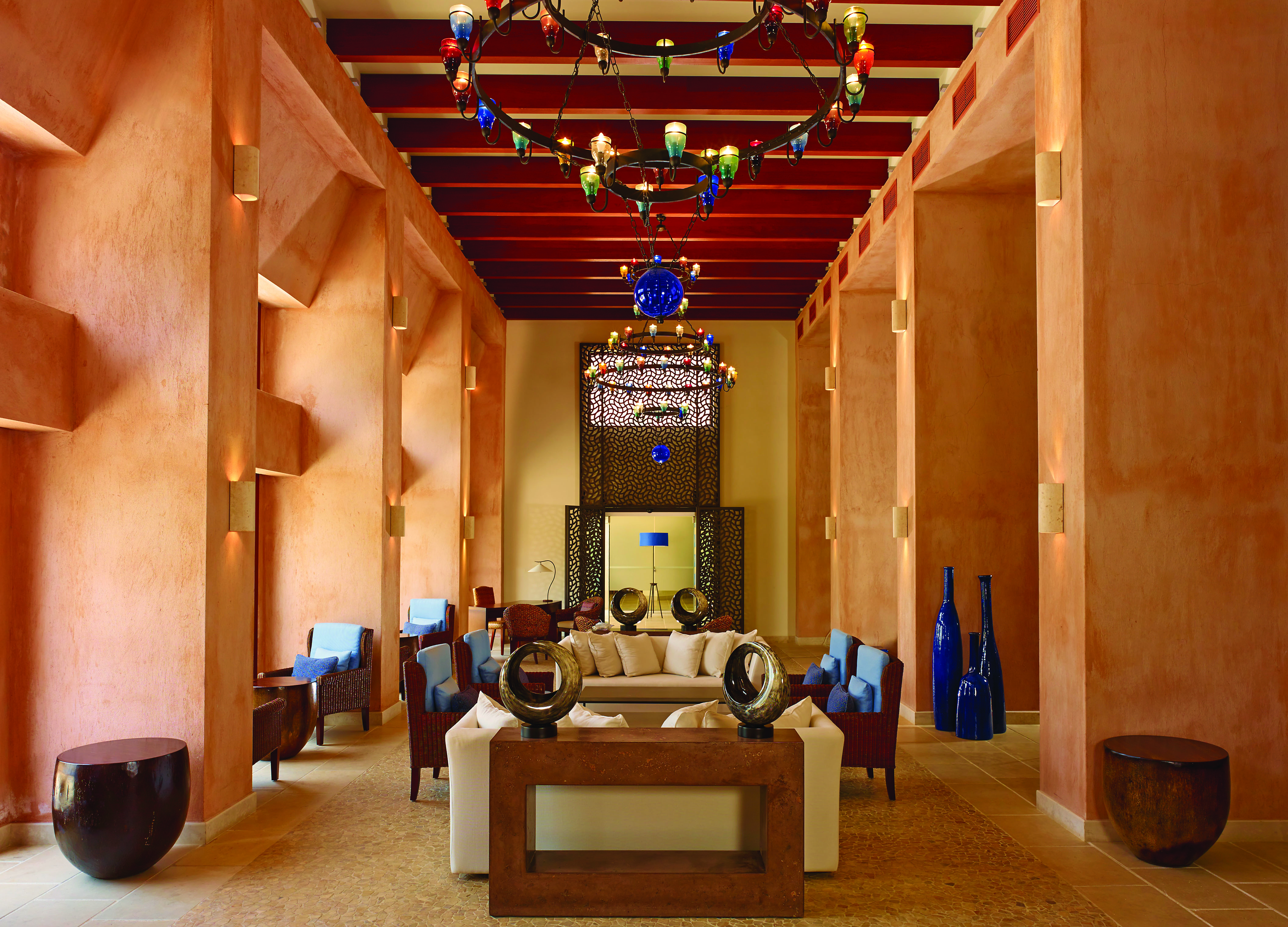 Blue Palace Greece lounge south wing area with terracotta walls and lanterns