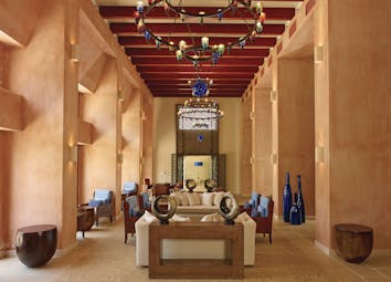 Blue Palace Greece lounge south wing area with terracotta walls and lanterns