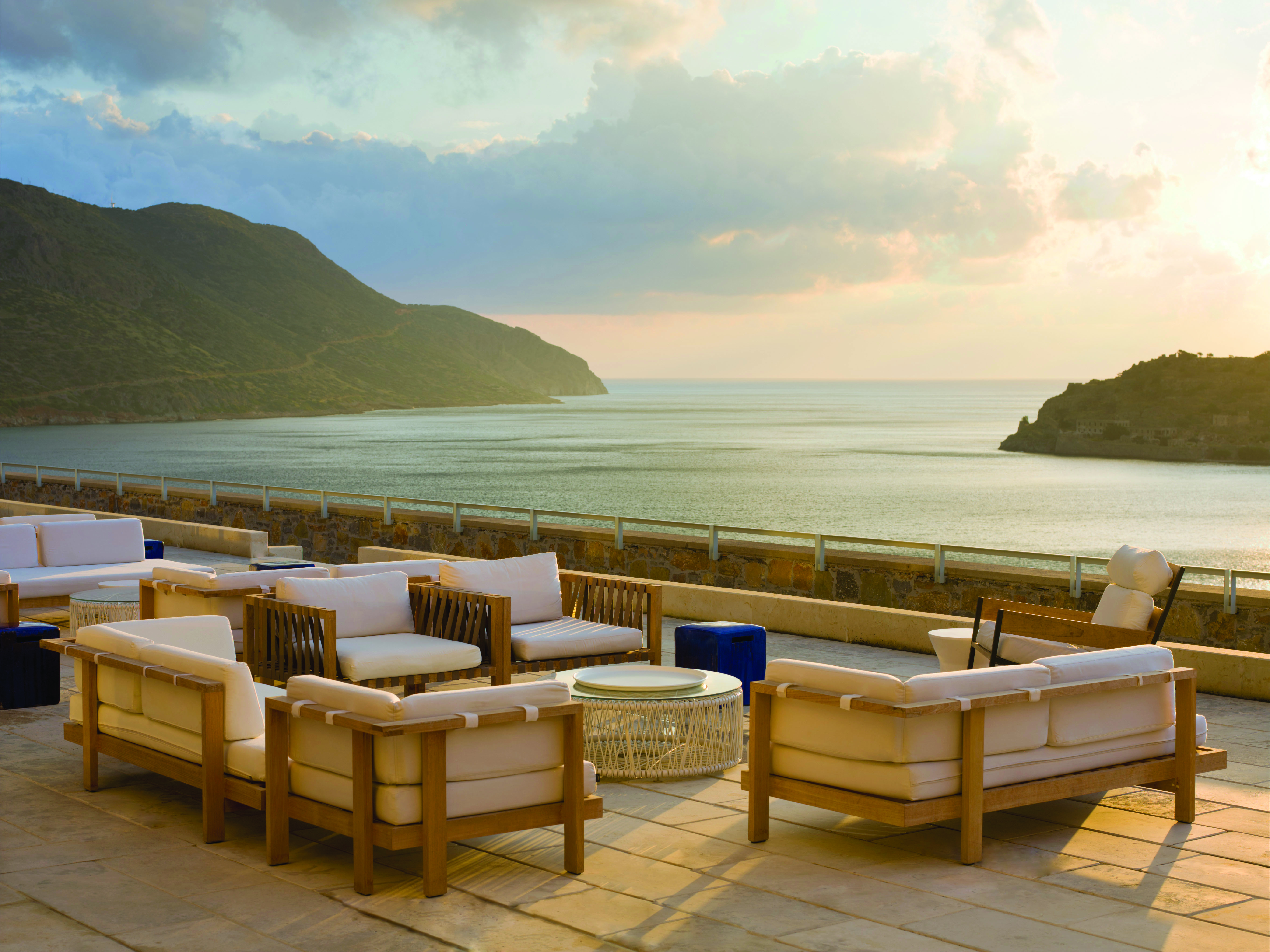 Blue Palace Greece terrace area with armchairs and sea view