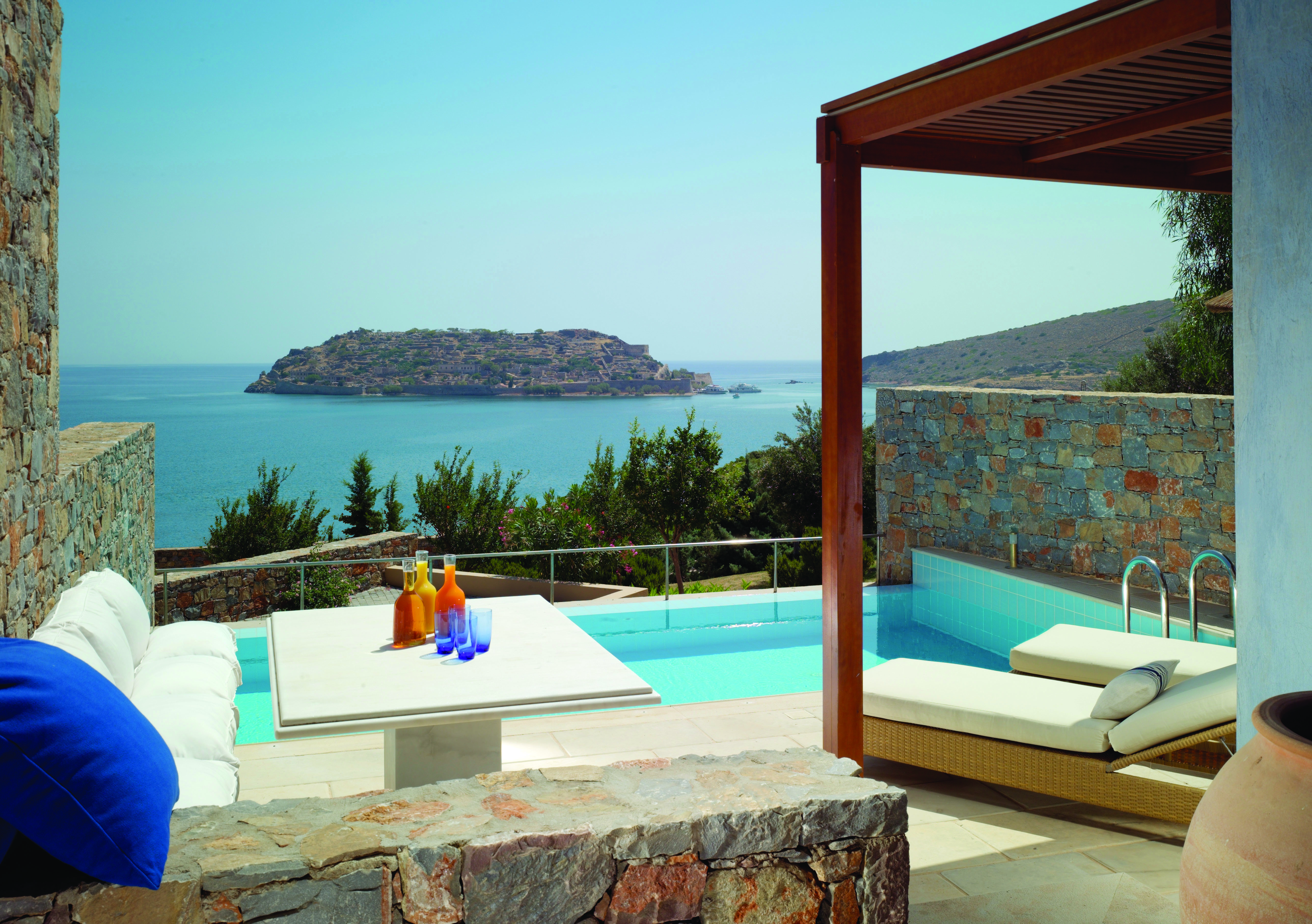 Blue Palace Greece villa Almyra private pool area with sea view and sun loungers