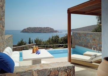 Blue Palace Greece villa Almyra private pool area with sea view and sun loungers