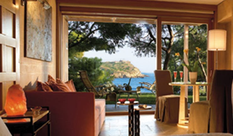 Cape Sounio Greece bungalow living room deck sitting area sea view